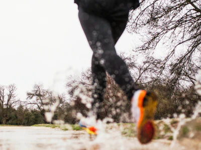 Woman running in the rain
